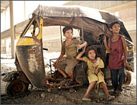 Ayush, Rubina Ali and Azhrauddin Mohammad Ismail in a scene from Slumdog Millionaire